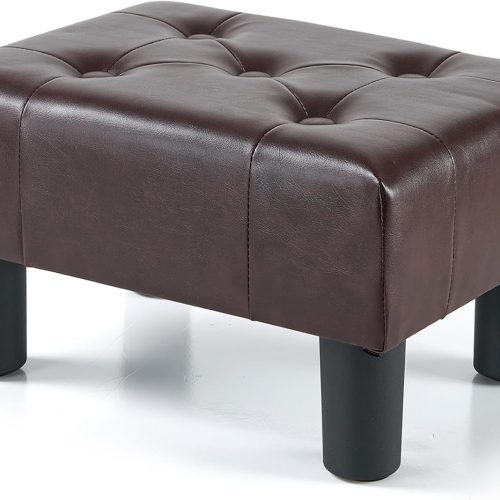 Small foot stool with legs, leather upholstered, stable construction for living room.