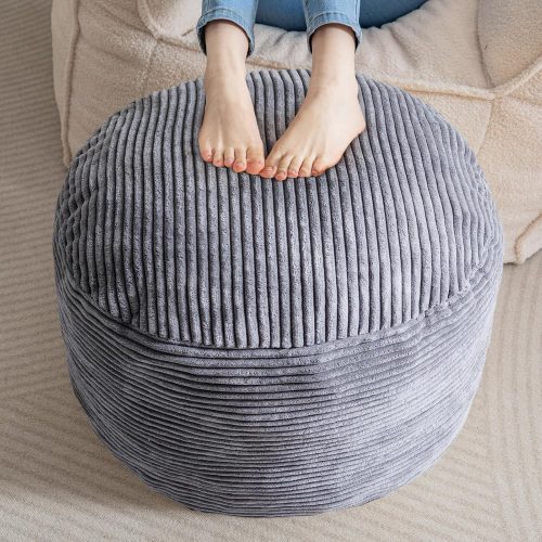 Round stuffed pouf ottoman, corduroy fabric, foam chunk filling, furry foot stool for living room.